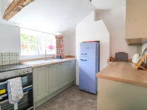 Kuchyň nebo kuchyňský kout v ubytování Brook Cottage