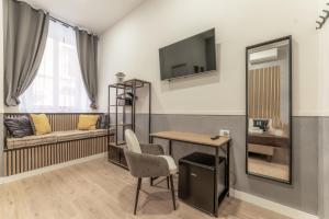 Una televisión o centro de entretenimiento en Bello Urban Boutique - Golden Keys Collection