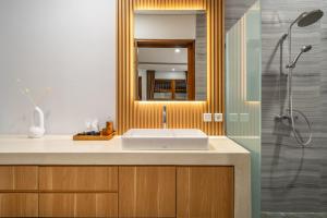 a bathroom with a sink and a shower at Stunning 2BDR Villa with Private Pool in CANGGU in Canggu +6 photos