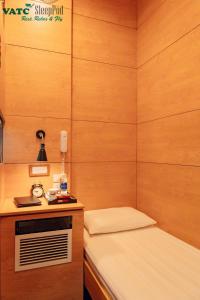 Postel nebo postele na pokoji v ubytování VATC Sleep Pod Terminal 2