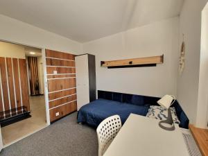 Łóżko lub łóżka w pokoju w obiekcie Apartamenty Promyk Wisełka