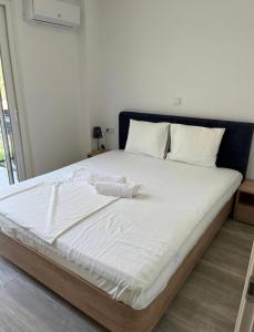 Postel nebo postele na pokoji v ubytování Palm Residential