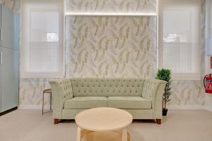 a living room with a couch and a table at Apartamentos Panda by Clabao in Pamplona