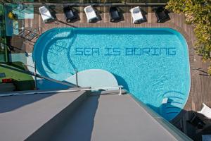 an overhead view of a swimming pool at Hotel Perla - The storyhoteller in Riccione