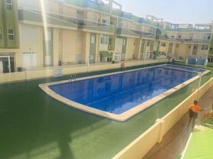 The swimming pool at or close to Delfines III Solo Familias Serviplaya