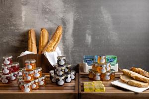 a table with a bunch of food and bread at The Queens Gate Hotel in London