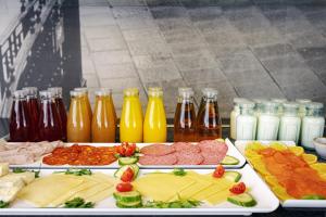 a table filled with different types of food and drinks at The Queens Gate Hotel in London