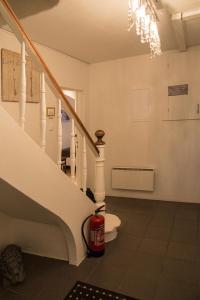 a room with a staircase with a fire hydrant at Kósý Vík in Vík