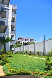 a yard in front of a building at Kezmo Paradise in Mombasa