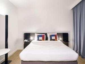 Postel nebo postele na pokoji v ubytování Novotel Paris Charenton le Pont