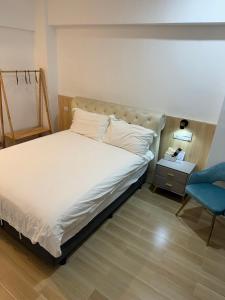Llit o llits en una habitació de Happiness B&B