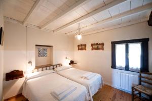 Postel nebo postele na pokoji v ubytování La Llosuca Rural