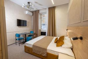 Postel nebo postele na pokoji v ubytování Jam Apartments Miskevycha