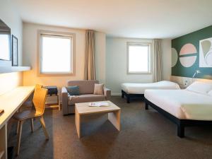 Letto o letti in una camera di ibis Styles Guéret