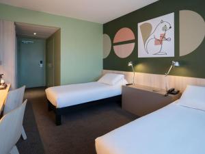 Letto o letti in una camera di ibis Styles Guéret