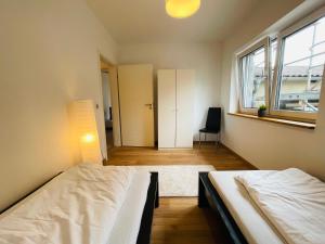 Postel nebo postele na pokoji v ubytování Dill Apartment Pleinfeld am Brombachsee I