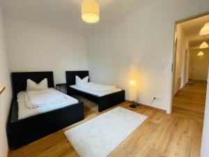 Postel nebo postele na pokoji v ubytování Dill Apartment Pleinfeld am Brombachsee I