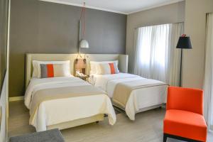 Letto o letti in una camera di Clarion Faria Lima
