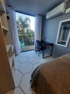 Posezení v ubytování Apartamento Container com Sacada, Split e Estacionamento
