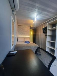 Postelja oz. postelje v sobi nastanitve Apartamento Container com Sacada, Split e Estacionamento