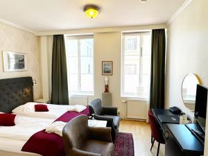 Postel nebo postele na pokoji v ubytování Hotel Concordia