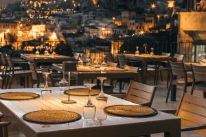 a table with wine glasses on top of a restaurant at Lagania In Cave in Urgup