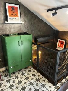 a green cabinet in the corner of a room at Domus Lapidea in Postira +16 photos