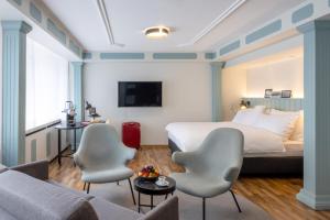 TV a/nebo společenská místnost v ubytování Hotel Luzernerhof