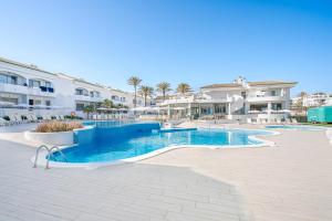 a swimming pool in the middle of a resort at THB Guya Playa in Cala Ratjada