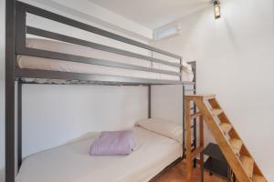 a bunk bed in a room with a ladder at Vivienda vacacional La Era I in Vallehermoso