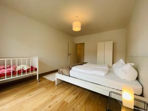 Postel nebo postele na pokoji v ubytování Dill Apartment Pleinfeld am Brombachsee I