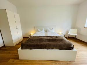 Postel nebo postele na pokoji v ubytování Dill Apartment Pleinfeld am Brombachsee I