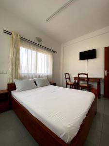 Postel nebo postele na pokoji v ubytování Stella Maris Hotel