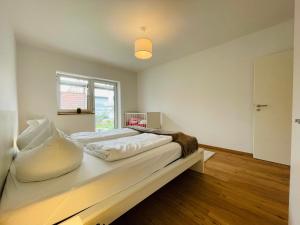 Postel nebo postele na pokoji v ubytování Dill Apartment Pleinfeld am Brombachsee I