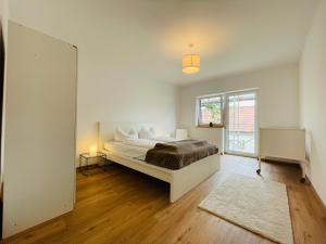 Postel nebo postele na pokoji v ubytování Dill Apartment Pleinfeld am Brombachsee I