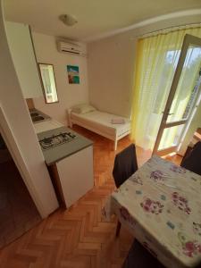 Postel nebo postele na pokoji v ubytování Apartmants Emy