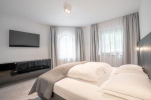Postel nebo postele na pokoji v ubytování Chalet Madlein