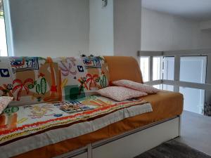 Giường trong phòng chung tại Your Lovely Nest in Como