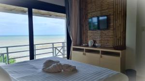 Postel nebo postele na pokoji v ubytování Moonlight Bay Resort