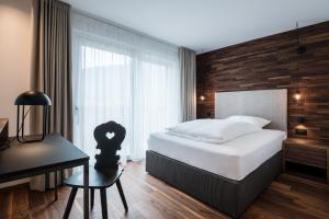 Posteľ alebo postele v izbe v ubytovaní Hotel Ciasa Tamá