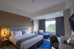 Letto o letti in una camera di Oakwood Merdeka Bandung