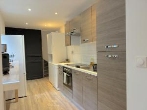Kuchyňa alebo kuchynka v ubytovaní Maison Cosy 10 Personnes 3 SDB proche Lille