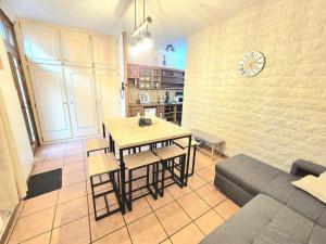 a living room with a table and a couch at Maison Titiane in Mers-les-Bains +11 photos