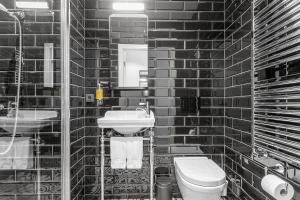 Koupelna v ubytování Hotel Aska
