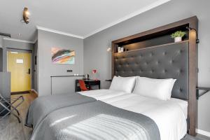 Postel nebo postele na pokoji v ubytování Hotel Aska