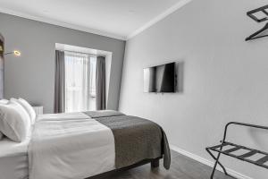 Postel nebo postele na pokoji v ubytování Hotel Aska