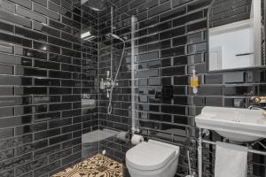 Koupelna v ubytování Hotel Aska
