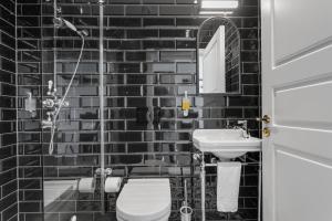 Koupelna v ubytování Hotel Aska