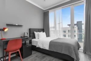 Postel nebo postele na pokoji v ubytování Hotel Aska