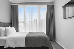Postel nebo postele na pokoji v ubytování Hotel Aska